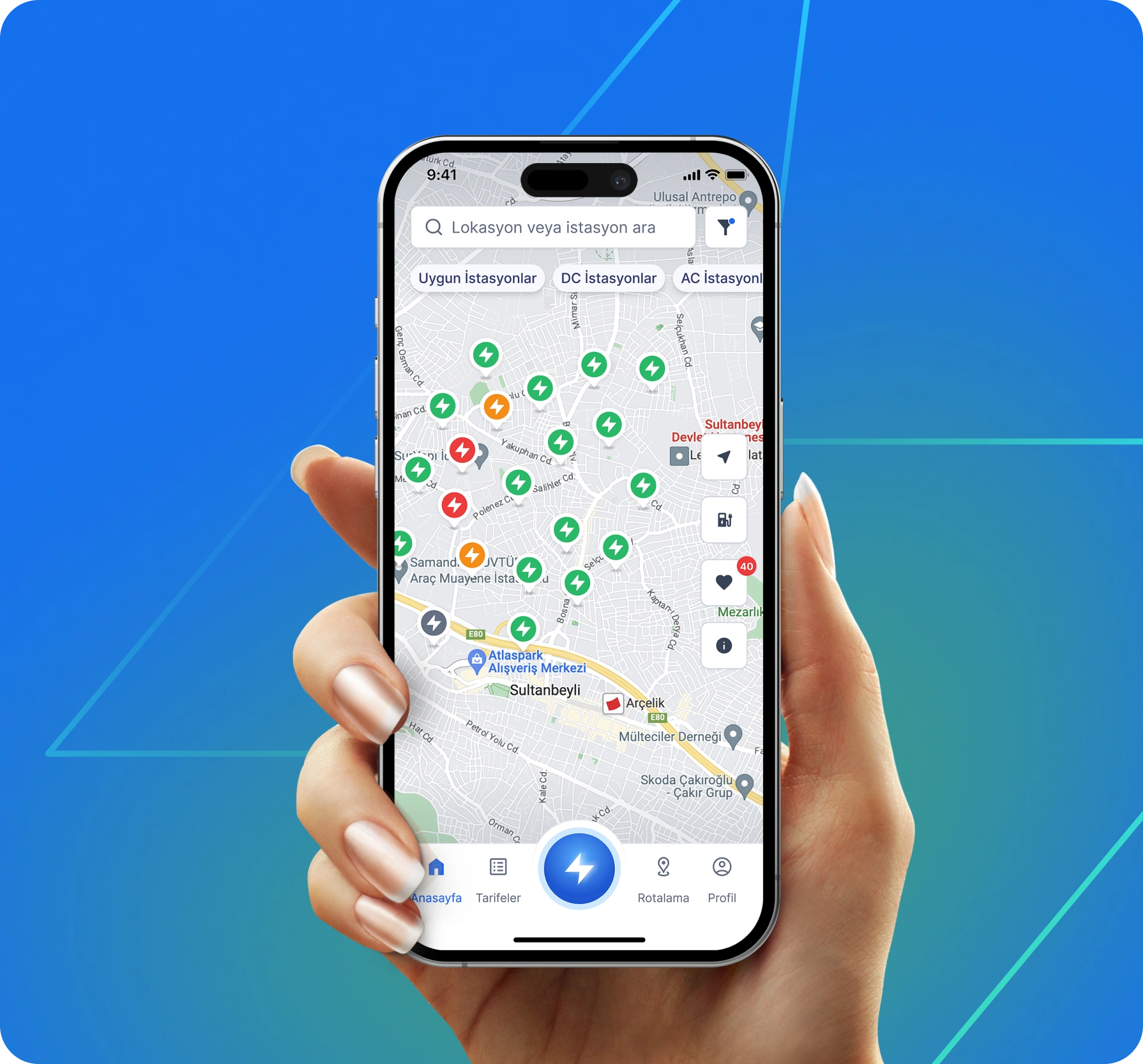 EMSOLL charging-station map displayed on a phone held in one hand